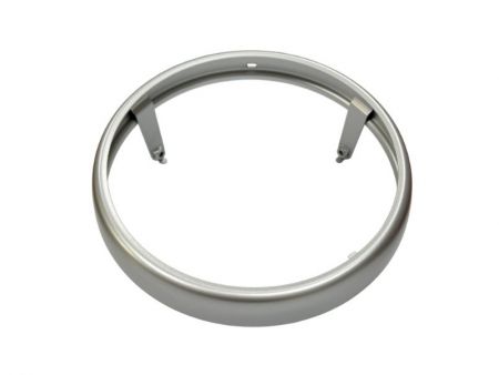 Steel motorcycle headlight bezel with electrocoating and silver wet paint finish.