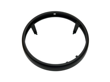 Steel motorcycle headlight bezel with electrocoating and matte black wet paint.